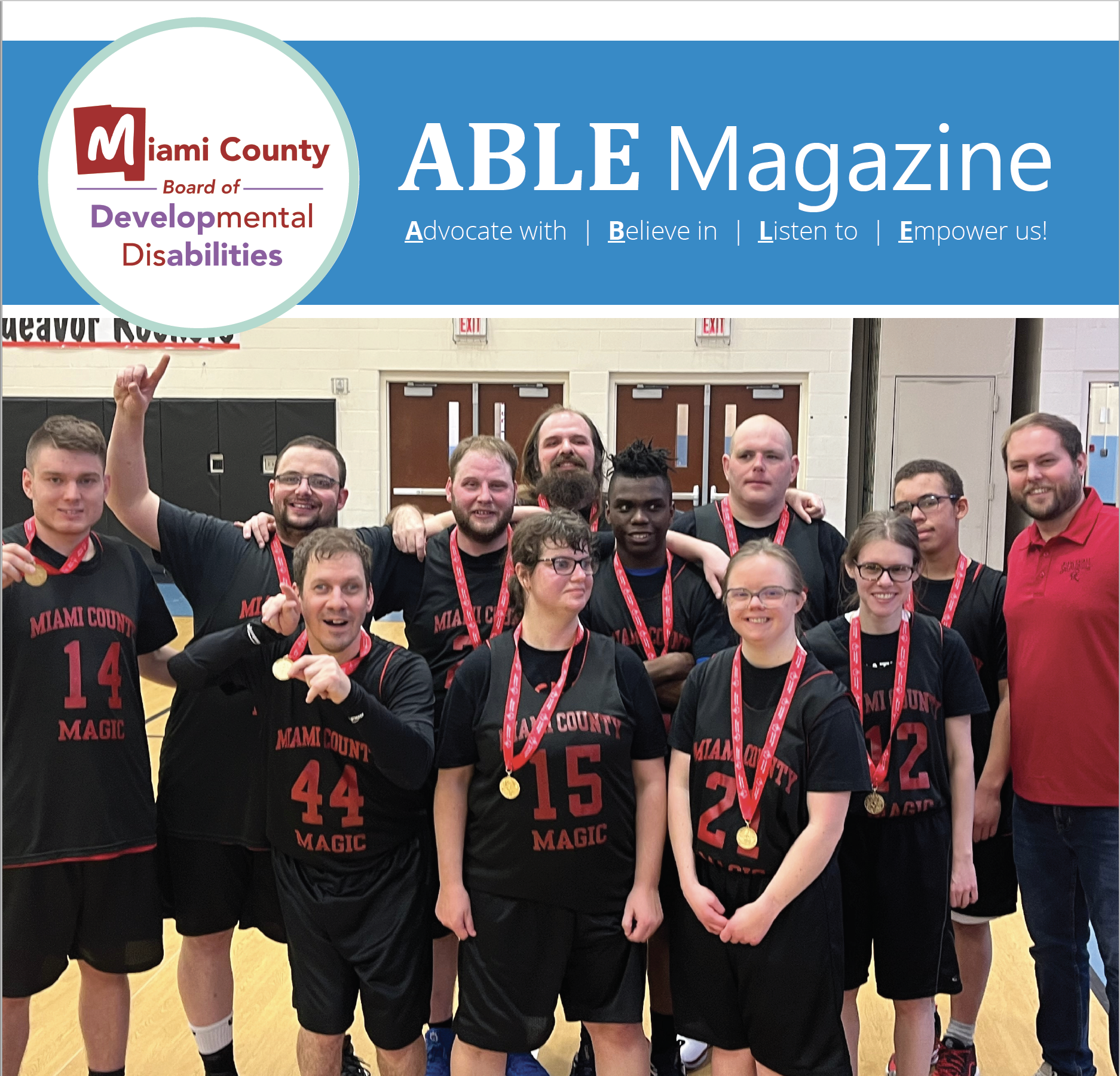 Cover of ABLE magazine with basketball athletes wearing their medals and smiling at the camera